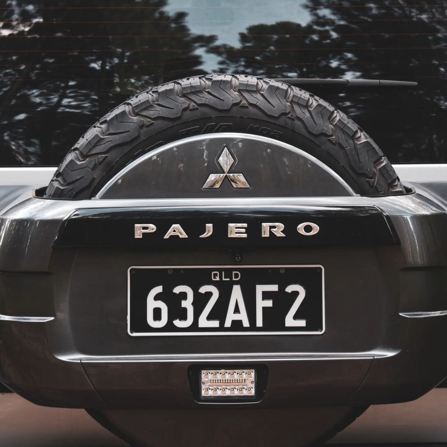 Front view of Mitsubishi Pajero chrome spare wheel sticker, highlighting its sleek design. Also showcases spare wheel light.