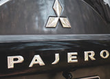 Front view of Mitsubishi Pajero chrome spare wheel sticker, highlighting its sleek design.